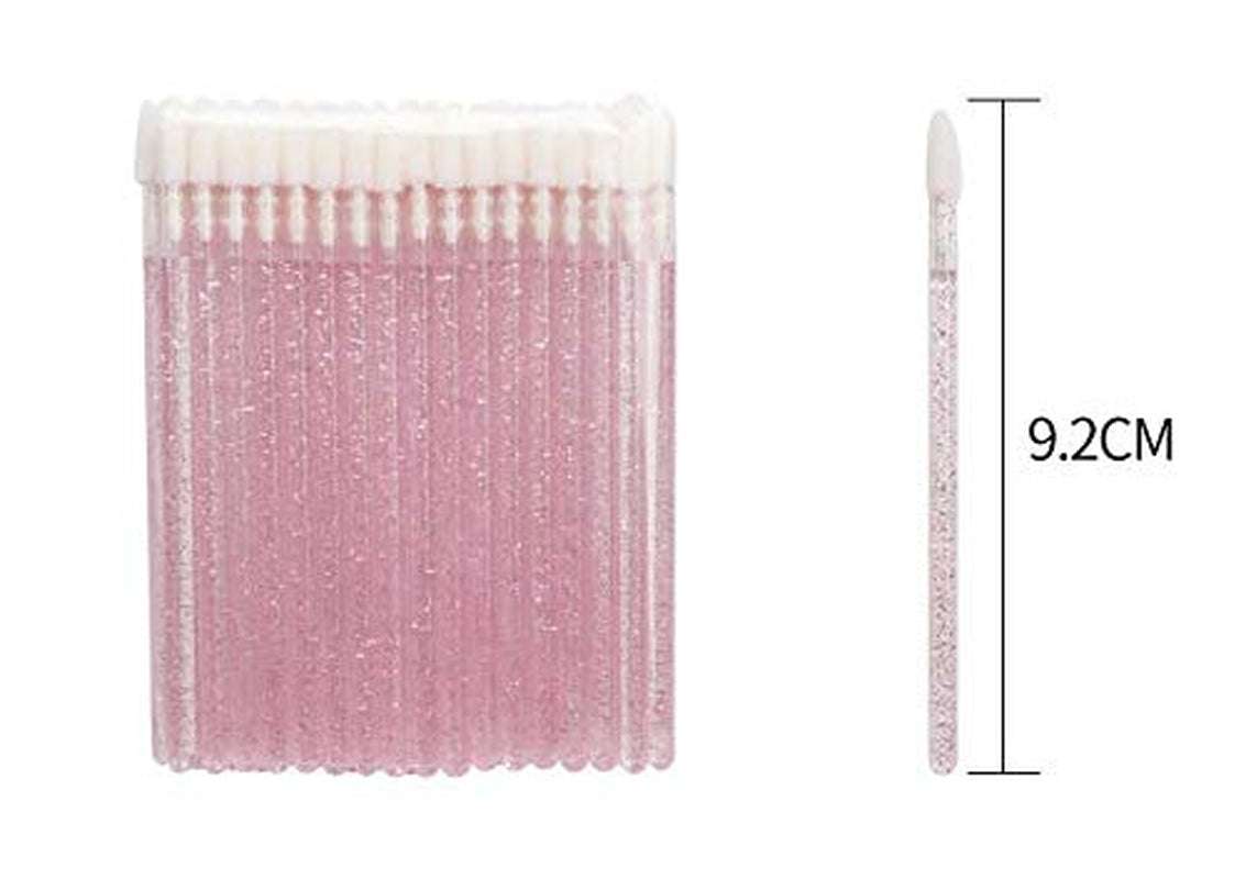 Disposable crystal lip brushes with fine tips and transparent handles for precise lipstick application, ideal for travel and hygiene.