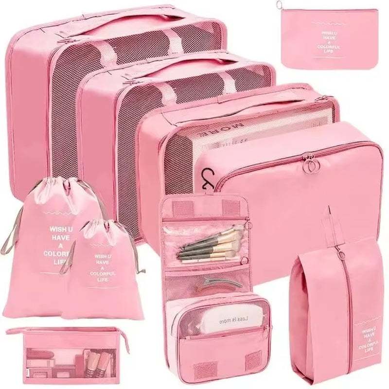 Pink travel organizer storage bag set with multiple packing cubes, laundry bags, and shoe pouches for efficient suitcase organization.