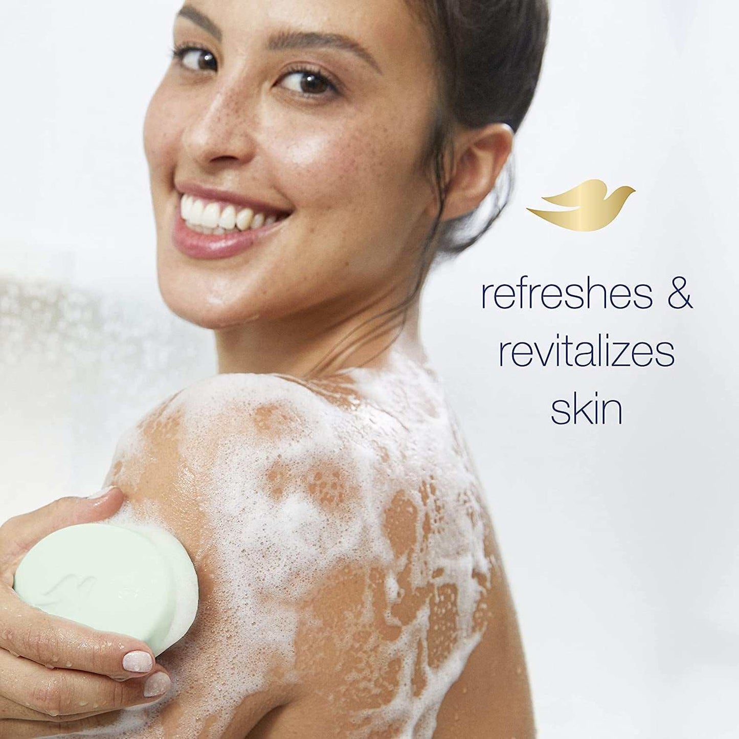 Woman using ultra-moisturizing skin care beauty bar with foam on shoulder refreshing and revitalizing skin