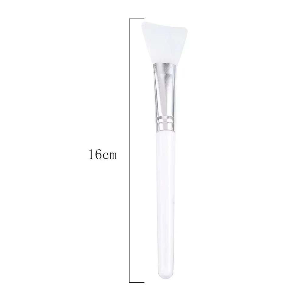 Silicone facial mask brush with soft, flexible head and durable handle for precise skincare application.