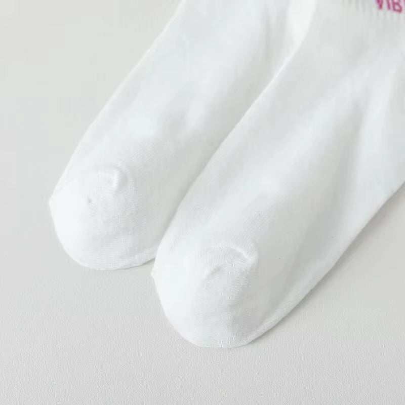 Women white smiling face sock, soft cotton blend, fun and stylish design, ankle-length, breathable and lightweight.