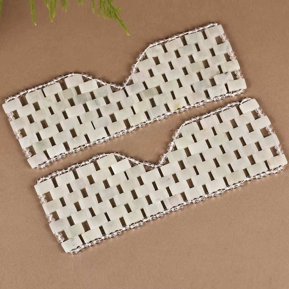 Natural jade eye mask set for facial massage and relaxation therapy.