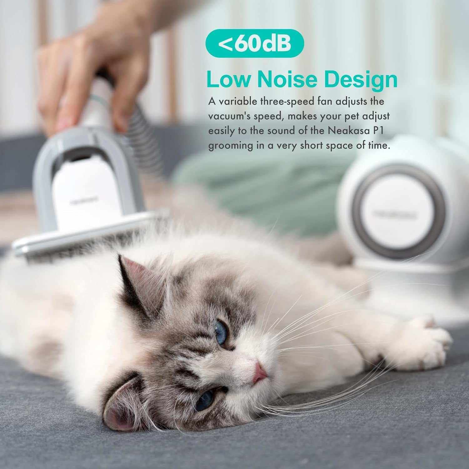 Pet grooming vacuum with low noise design gently grooming a relaxed cat with vacuum suction tool