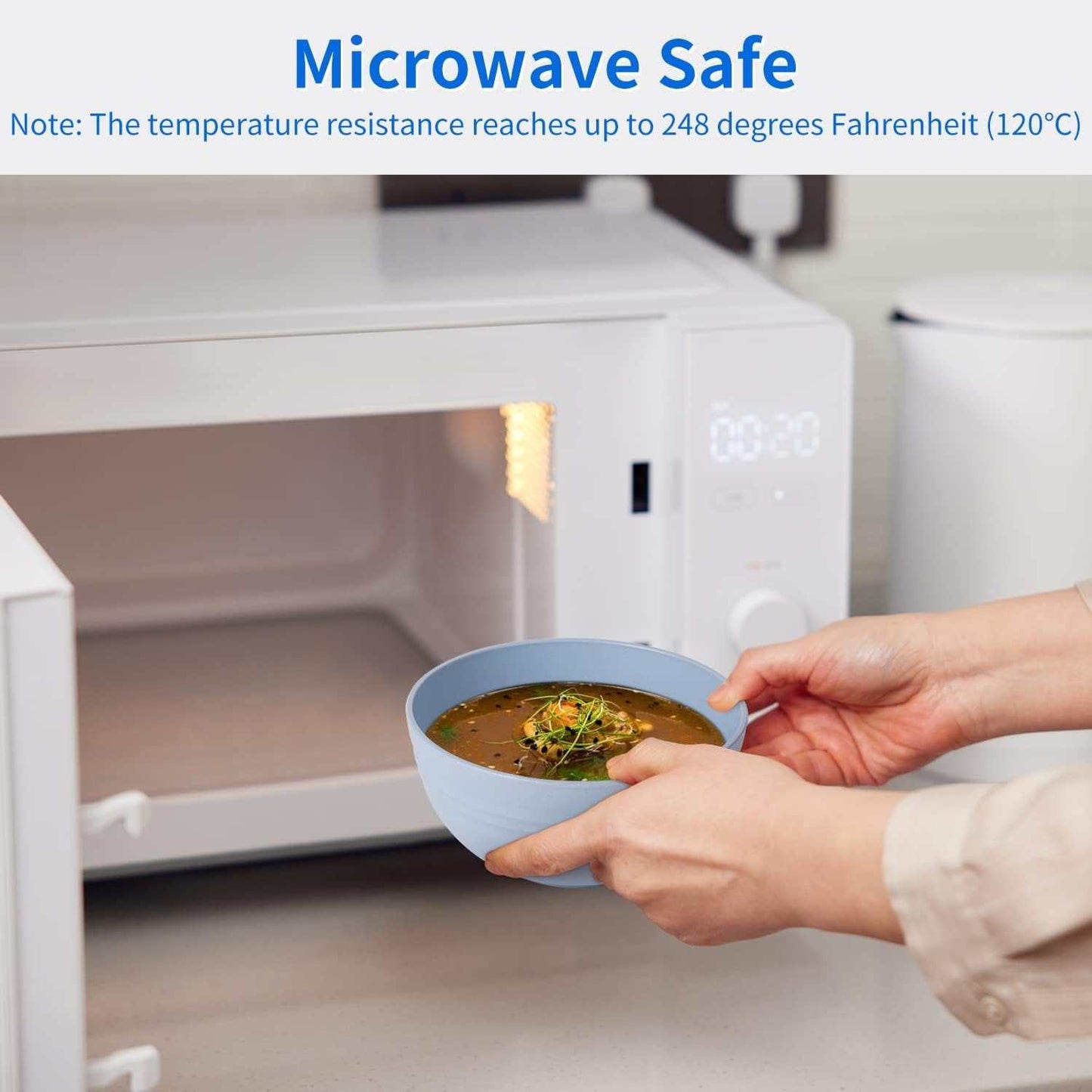 Microwave safe wheat straw dinnerware bowl with soup being removed from a microwave, highlighting heat resistance.