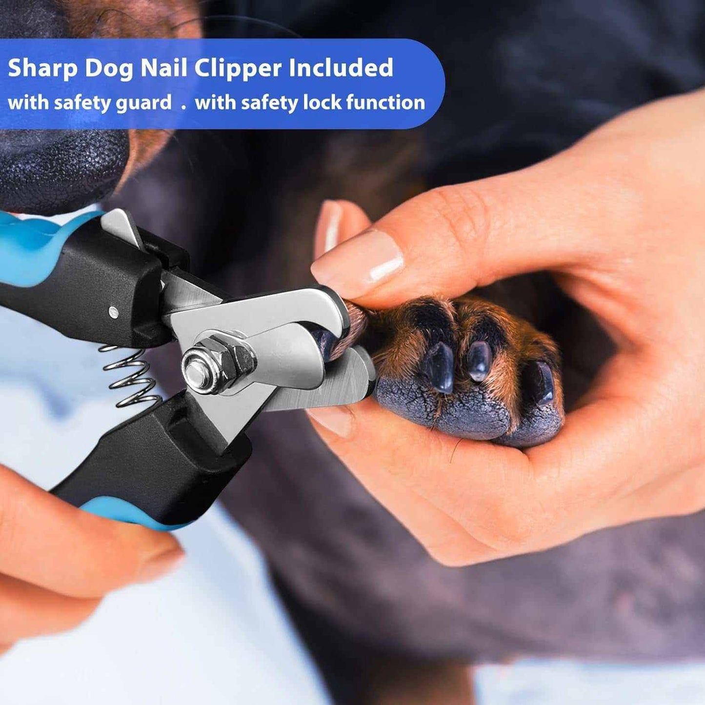 Dog nail clipper with safety guard and lock function trimming a dog's nails close-up
