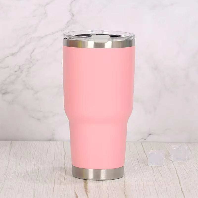 Stainless steel travel tumbler with pink finish, vacuum insulation, and spill-resistant lid.