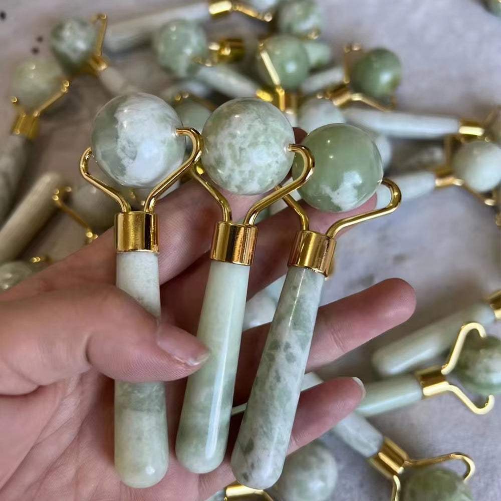 Natural jade face rollers for skincare, featuring dual-ended design for circulation and puffiness reduction.