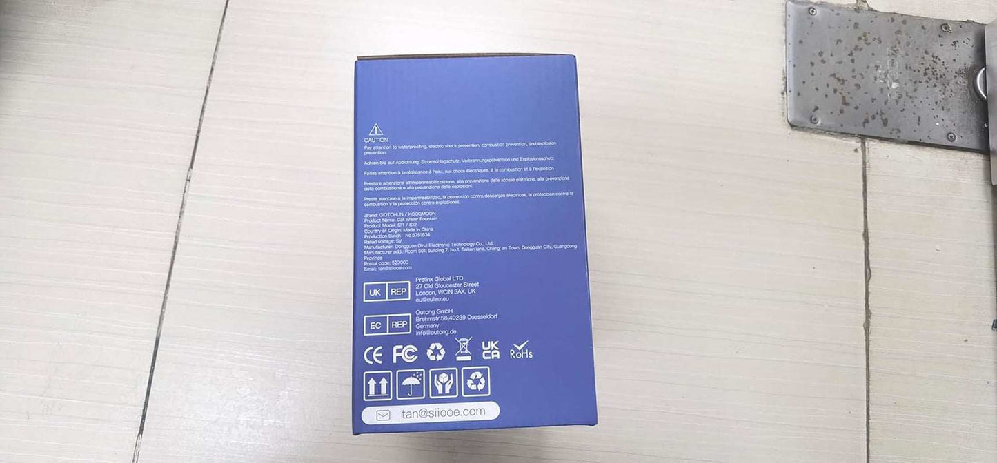 Blue box packaging of Pet Stainless Steel Water Fountain for cats and small animals with product and safety information.