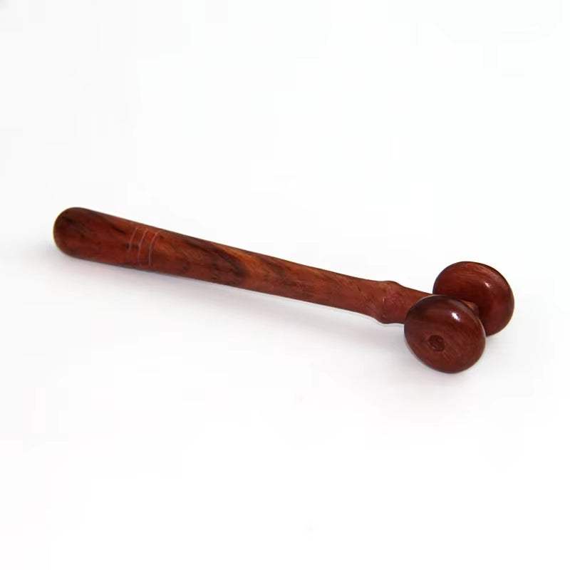 Wooden body massage stick for deep tissue and acupressure therapy.