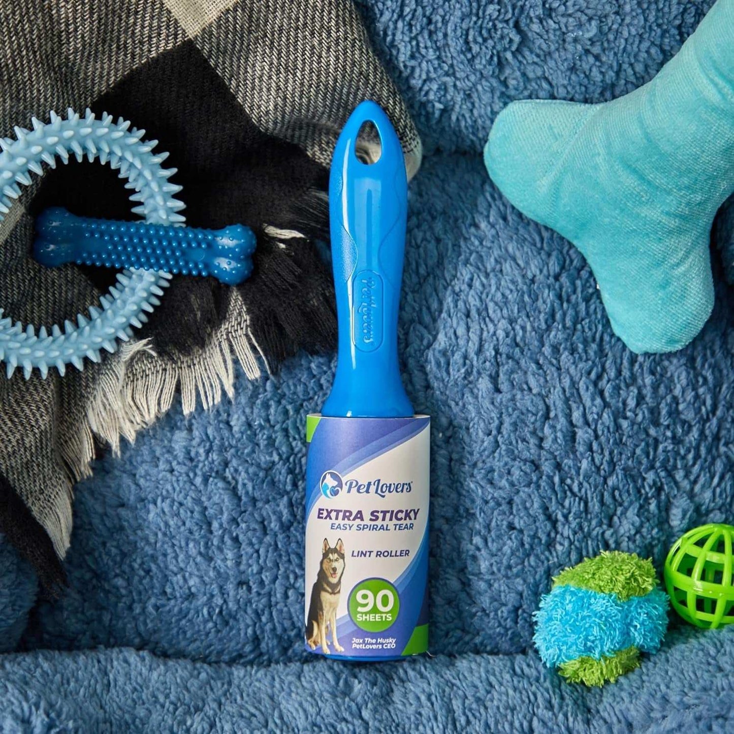 Pet Hair Removal Lint Roller with extra sticky sheets and ergonomic blue handle for removing pet hair from clothes and furniture.