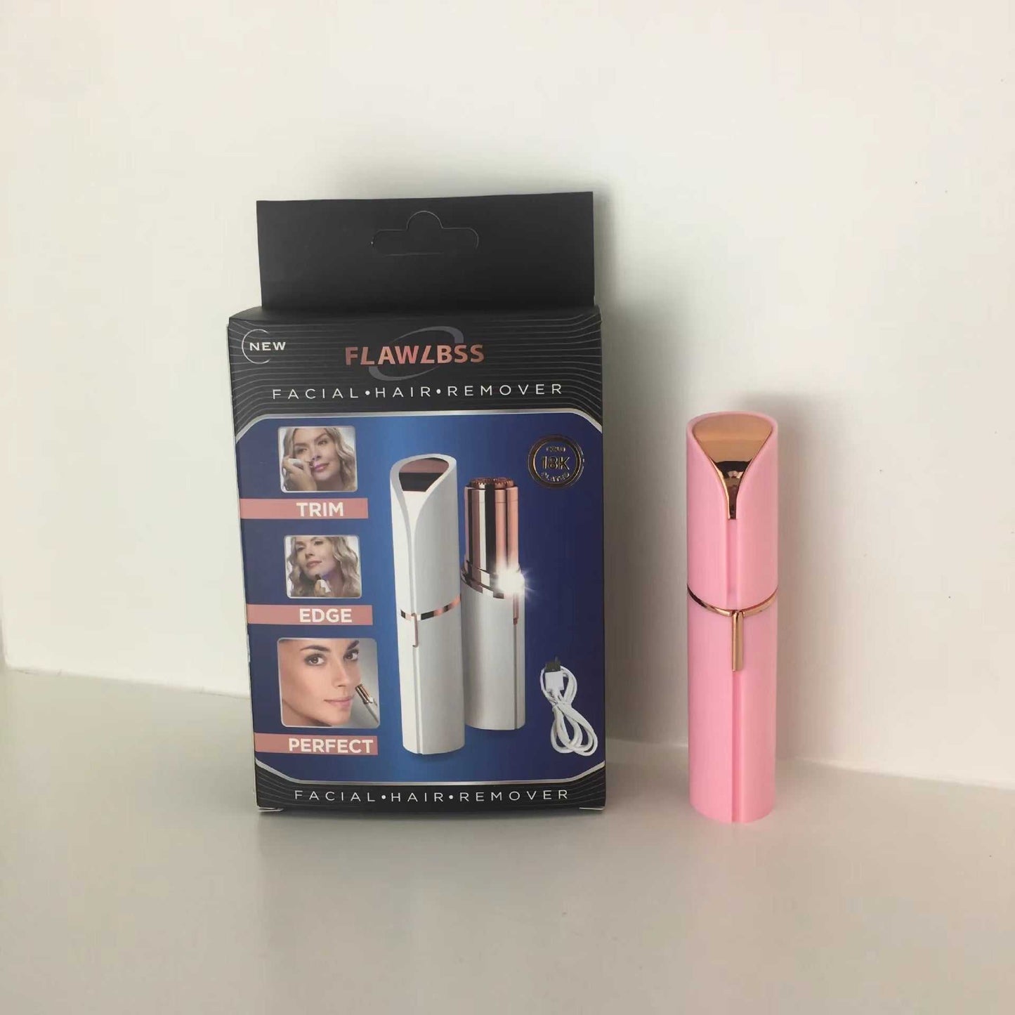 Portable electric hair removal trimmer with lipstick-style design and packaging; includes rechargeable cable.