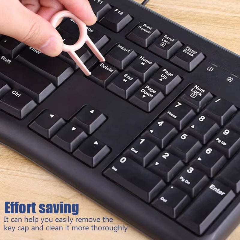 Keyboard keycap remover from 7-in-1 electronic cleaning kit.