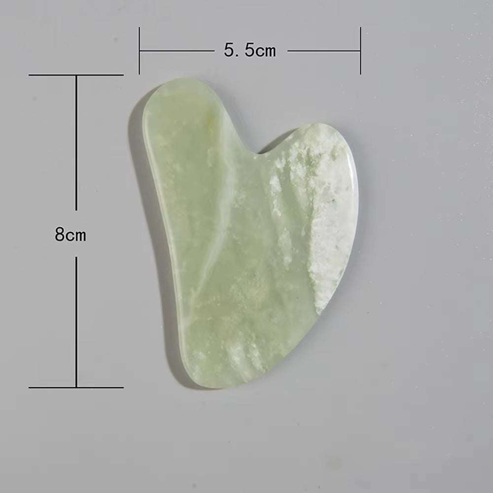 Natural jade gua sha scraper tool; face and body massage, puffiness reduction, skincare therapy.