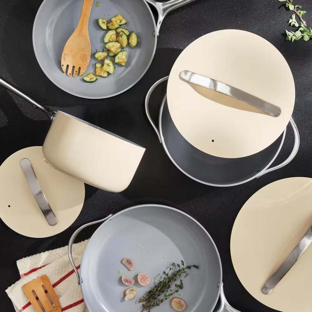 Natural bamboo spoon kitchen tool set on non-stick cookware.