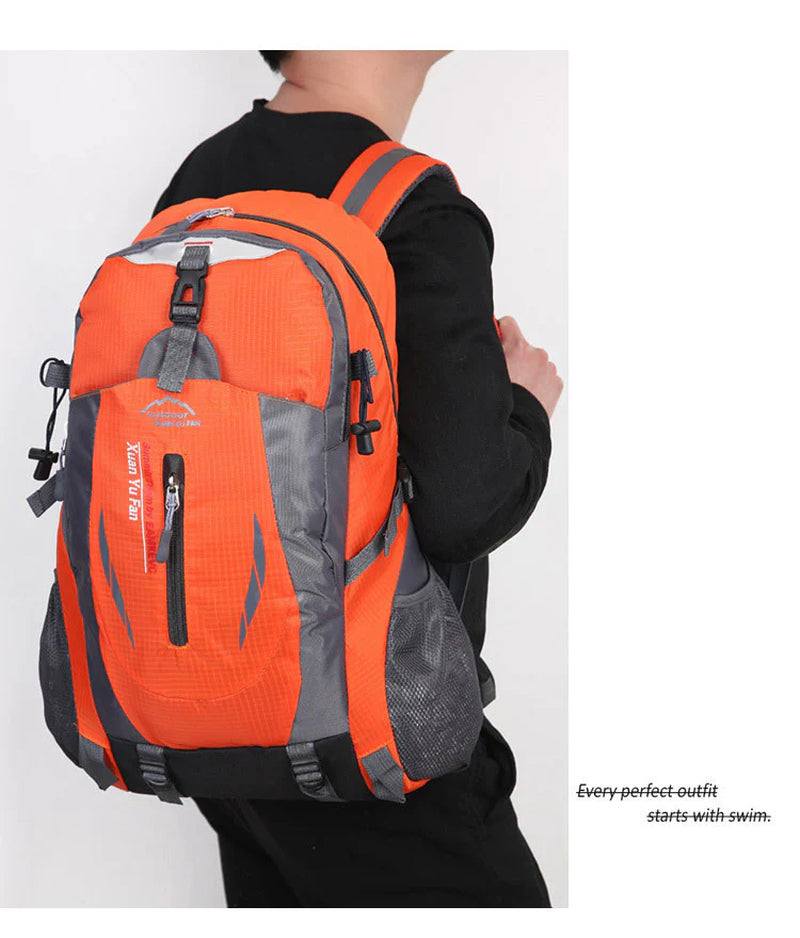 Rucksack Laptop Travel Backpack in orange and gray with adjustable straps and multi-compartment design, ideal for versatile travel.