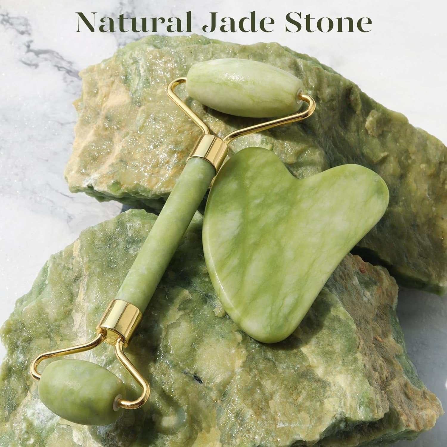 Facial massage gua sha jade roller set on natural stone background, green color.