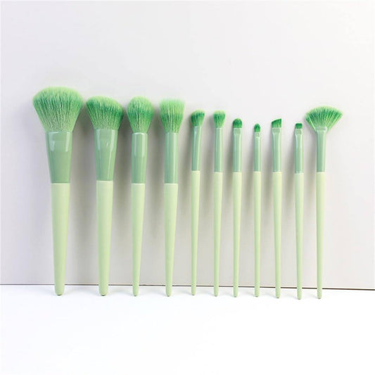 11-piece green makeup brush set with soft synthetic bristles for beginners and pros.