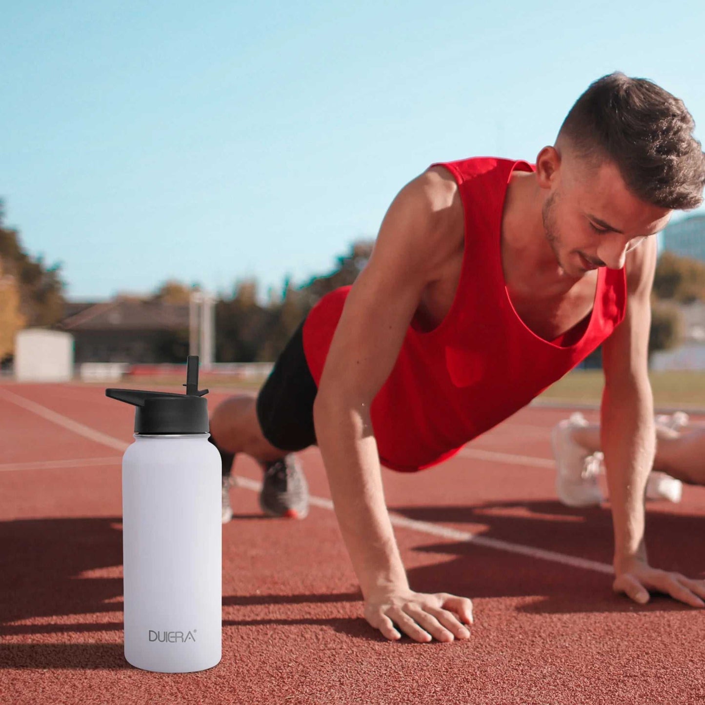 Vacuum Insulated Water Bottle with built-in straw and durable stainless steel for gym and outdoor use.
