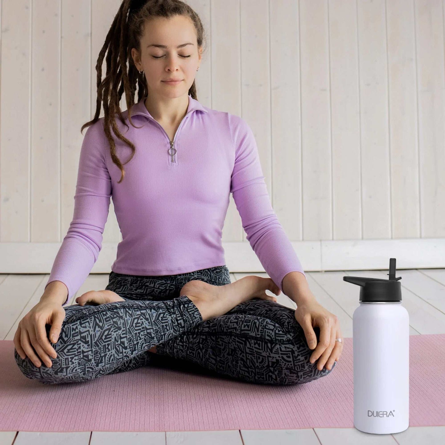 Vacuum insulated water bottle with leak-proof lid and straw, perfect for yoga and daily hydration.